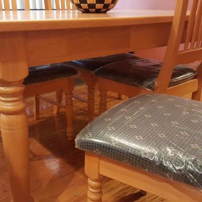 Chairs to dining table still have factory wrapping 