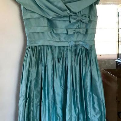 Sorry, the family has removed vintage dresses from the sale. Lovely vintage dress