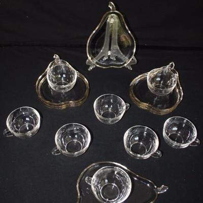 Pear Glass Luncheon Plates with Cups:  8 pear shaped stemmed glass plates with lip, measures 9" x 7". 8 glass tea cups with...