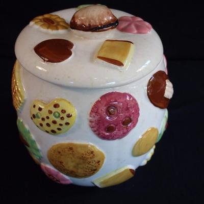 Vintage Cookie Jar:  Porcelain jar with lid features images of raised cookies, bottom stamped 