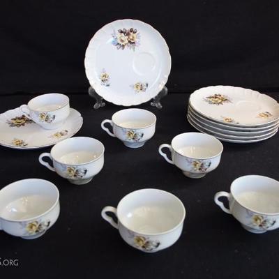 Porcelain China Luncheon Set: seven 10 ounce cups and seven 8" dessert plates hand painted with flowers in tones of blue, rose and...