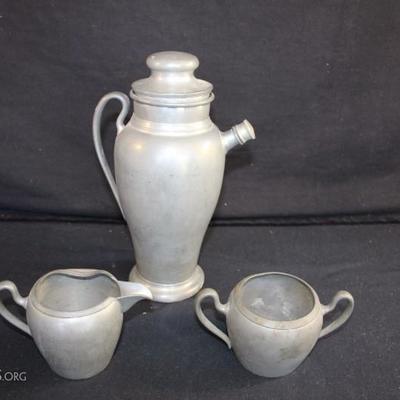 Pewter Entertaining Lot: all marked with logo of Royal Solid Pewter M.M. Co. Martini shaker 10.75" tall and cream (3.5" high)...