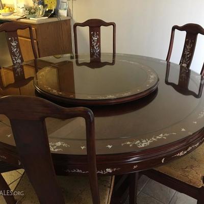 Rosewood Dining Table and 6 Chairs with beautiful Mother of Pearl Inlay Pattern.  A matching Lazy Susan is included and both the table...