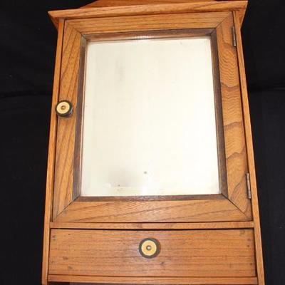 Oak Bathroom Medicine Cabinet w/bevelled mirror and drawer below:  It is 22