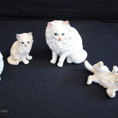 Trio of White Porcelain Cats & Avon Bottle: The ceramic cats are labelled and numbered. Mother cat is 5