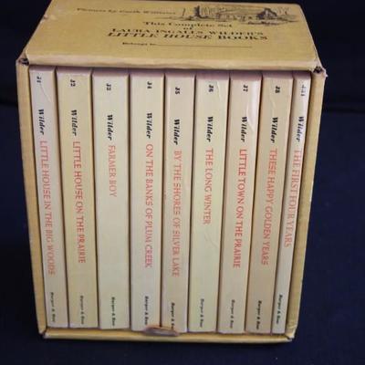 Boxed Set of Little House Books: includes 9 paperback books by Lara Ingalls Wilder, never been opened with cardboard housing.  