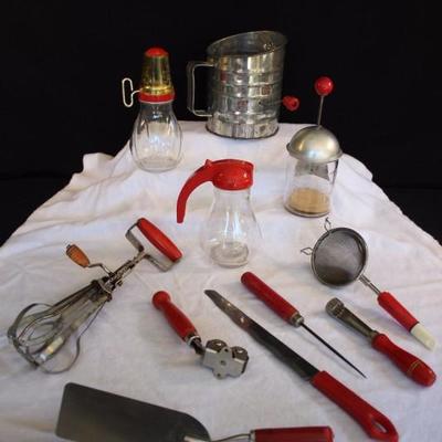 12-Piece 1940-50's Red Kitchen Utensils: 1 8-ounce glass and aluminum nut chopper marked Dispensers Inc. Los Angeles-New York...