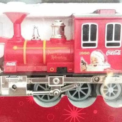 New in box Coca Cola Santa Steam Set, remote control steam engine with accessories.