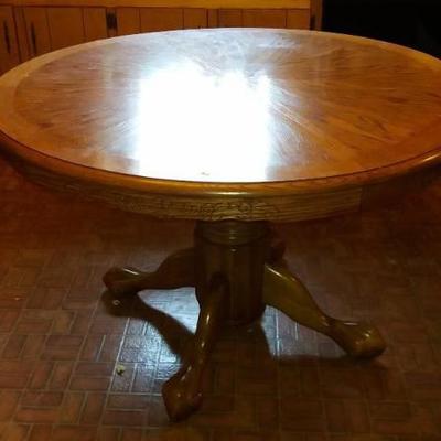 Round Oak Pedestal Table (48 inches round) with additional (48 inch leaf) (31 inches high).