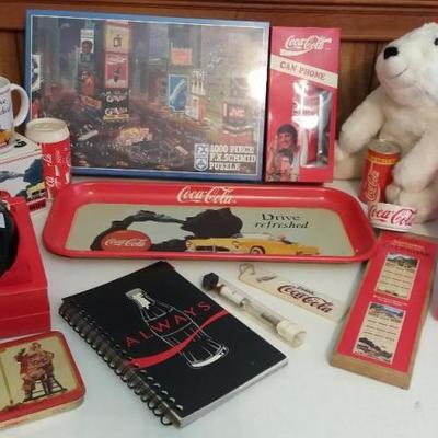 Assortment of Coca-Cola items - 1000 piece jigsaw puzzle, one (1) ceramic candleholder and one (1) t
