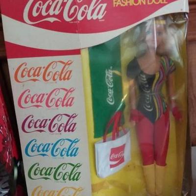 Assorted lot of Coca-Cola items - Coca-Cola Enternal lamp, aerobic fashion doll, Coke bottle phone a