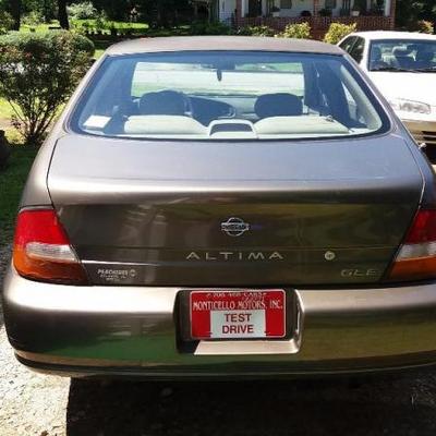 1998 Bronze Nissan Altima GLE, four (4) door sedan, 227,884 miles, automatic with leather seats.