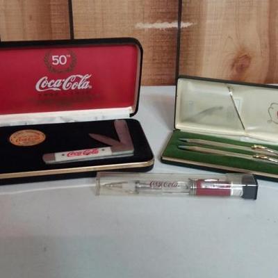 Commerative pocket knife in case, cross set pencil and pen bearing the name Coca-Cola, Coca-Cola pen