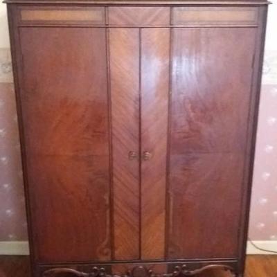 Armoire with two (2) doors in walnut finish with inlay wood; interior with hanging rod and three dra