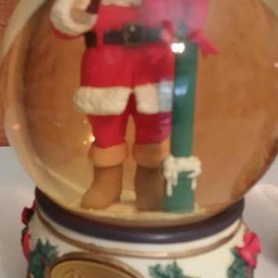 Three (3) snow globes - Santa jumping over bottle cap, Santa drinking a Coke and Santa carrying pres