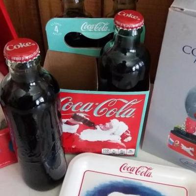 Variety of Coca-Cola items - White Polar bear with light and sound in red hat, trading cards for Coc