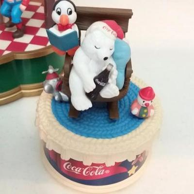 Santa serving at the Soda Fountain (music box), polar bear with penguin, polar bear with a seal, moo