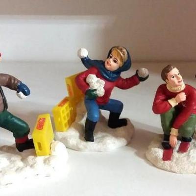 Lot of four (4) Coca-Cola Christmas Village Characters - two (2) boys throwing snow balls and two me