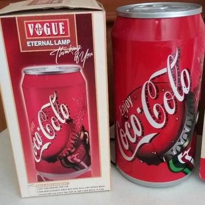 Assorted lot of Coca-Cola items - Coca-Cola Enternal lamp, aerobic fashion doll, Coke bottle phone a