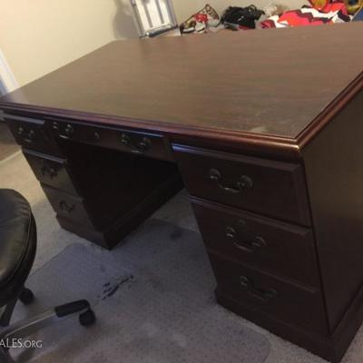 Oh the bills you will pay on this desk.  Lots of drawers and a big top to lose your pen on as well as your phone.  It's solid - bring...