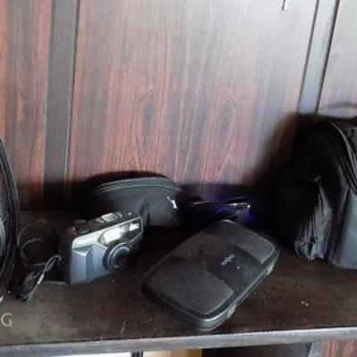 MIT066 Bushnell Binoculars, Pentax Camera, MP3 Speaker, Lens
