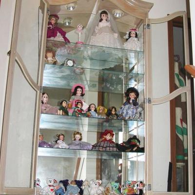 curio cabinet filled with dolls