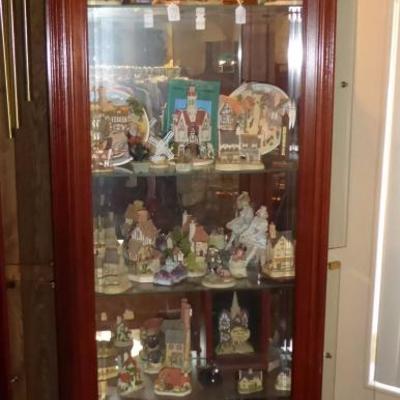 Curio cabinet full of David Winter cottages and Hummel collectibles..ALL 50% OFF