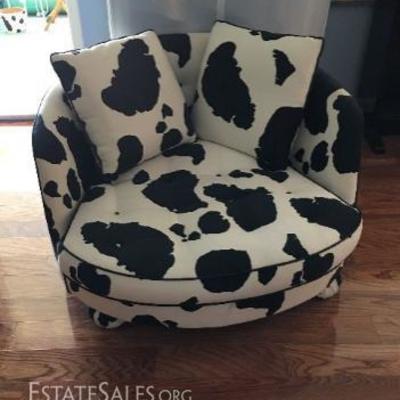 Adorable & very comfortable large love seat with upholstered cow fabric. Has round 'ball feet' - $130