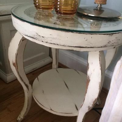 Lovely carved wooden accent table with glass top. Excellent Condition.