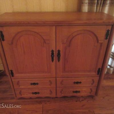 Custom made oak entertainment center with 4 bottom drawers