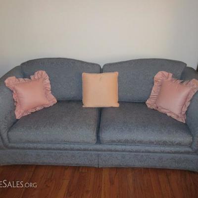 Beautiful blue fabric upholstered couch and love seat with rounded arms and back