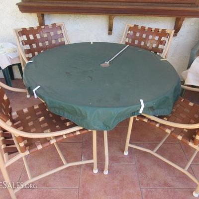 Outdoor patio set with glass table top and 4 chairs