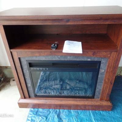 Fire Place 1 with shelf - multi function remote - (needs new battery) and manual