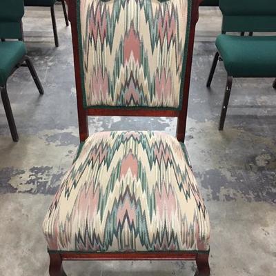 Rolling upholstered chair
