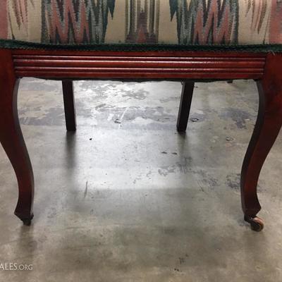 Rolling upholstered chair