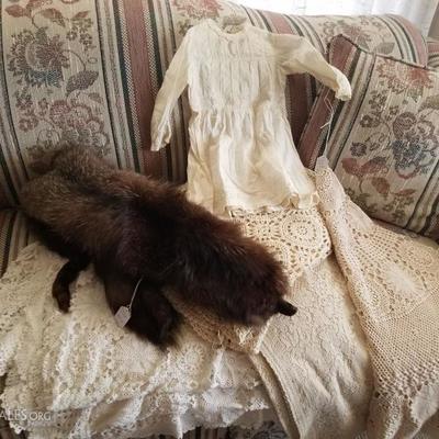 Antique baby dress..antique tablecloths/coverlett, fur wrap