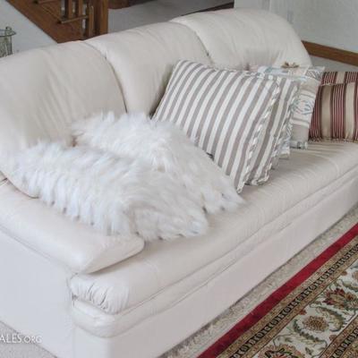 pristine leather couch and pillows