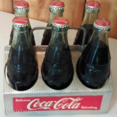 Vintage metal Coca-Cola Sixpack, including commemorative bottles printed in original old style class