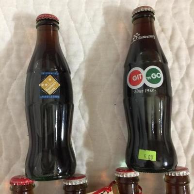 One 8 oz. Coca-Cola six pack mixed lot- Domino's Franchisee Association 1998 Inaugural Year 