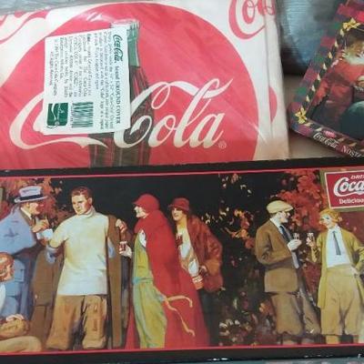Two Coke insulated carrying bags, one NIB ground cover/picnic cloth, Coke puzzle, two vintage scarve