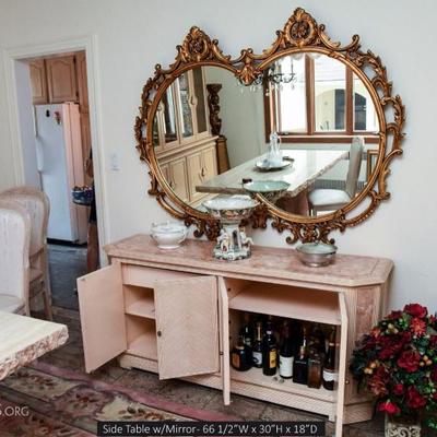 Buffet table with beautiful ornate mirror