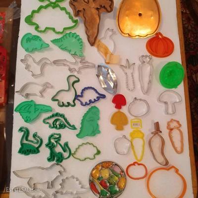 dinosaurs and veggies: Random Cookie Cutters priced 25 cents for plastic, .50 small tin cutters, $5 - $10 dollars for Copper cutters...