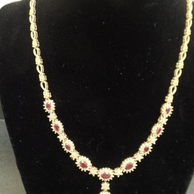 Gold, Ruby and Diamond Necklace. $6,000