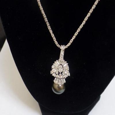 14 K Gold, Pearl and Diamond Pendant $4,000 Tahitian Pearl size 14.50mm. 2.63 tw in Diamonds