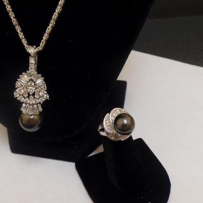 18 K White Gold, Diamond and South Sea Pearl Ring. $2,200 11mm Pearl. Diamonds 1.43 tw. 14 K Gold, Pearl and Diamond Pendant $4,000....