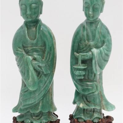 A pair of Antique carved Chinese Green Nephrite Guanyin (Guan Yin), the Goddess of Mercy. The pair are from the Fujian Province in S.E....