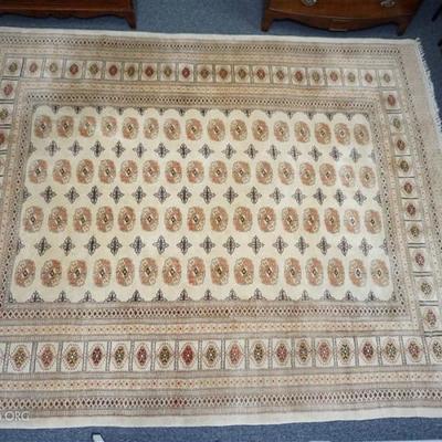 Good quality, semi-antique Field Bokhara Carpet. Pakistani, repeating rows of guls on central panel, multiple borders, black, golds and...