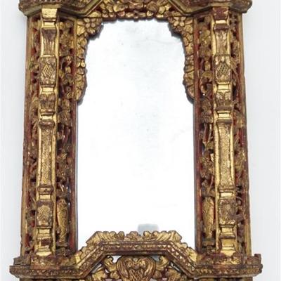 Early 20th century Ornate carved Chinese Export Mirror c. 1910-20. With the original red painted and gilt-highlighted relief-carved frame...