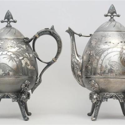 A very rare set of two matching 19th c. American Aesthetic Movement Japonesque Coffee and Tea Pots by Meriden. Each with Four Full Geisha...