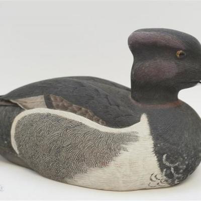 Hand carved and hand painted vintage duck decoy with glass eyes by Larry Horseman. Signed on the bottom, dated 1981. 12